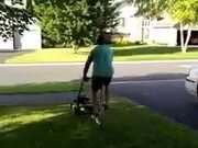 Guy Mows Lawn While Riding Unicycle