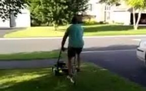 Guy Mows Lawn While Riding Unicycle - Fun - VIDEOTIME.COM