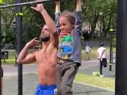 Strength & Conditioning Educator And Kid Hold Bar