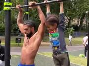 Strength & Conditioning Educator And Kid Hold Bar