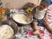 Kid Plays With Flour While Baking Cake With Mom