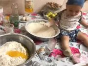 Kid Plays With Flour While Baking Cake With Mom
