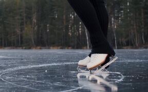 Figure Skater Performs on Frozen Lake - Sports - Videotime.com