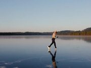 Figure Skater Performs on Frozen Lake