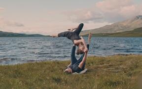 Acroyoga Duo Performed Advanced Flow by a Lakeside - Sports - VIDEOTIME.COM
