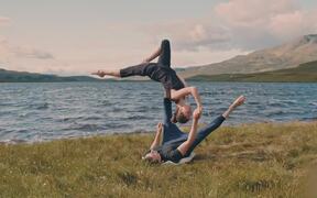 Acroyoga Duo Performed Advanced Flow by a Lakeside
