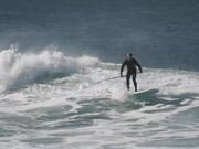 Guy Surfs on His Stand-up Paddleboard