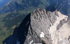 Wingsuit Pilot Glides Down Scenic Ridge - Sports - VIDEOTIME.COM