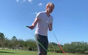 Guy Jumps Rope While Skipping on Teeterboard