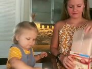 Toddler Assists Mom In Baking Cake