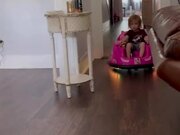Little Kid Drives Their Toy Car To Their Dad
