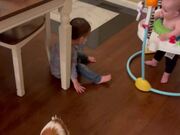 Boy Falls Down After His Brother Lets Go Of Cup