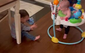 Boy Falls Down After His Brother Lets Go Of Cup
