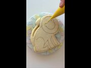 Person Decorates Lion Shaped Cookie
