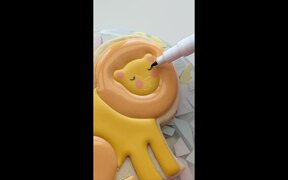 Person Decorates Lion Shaped Cookie - Fun - VIDEOTIME.COM