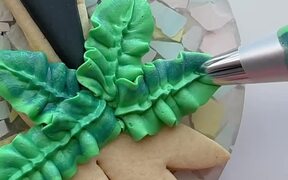 Person Decorates Cookie in Tropical Theme - Fun - VIDEOTIME.COM