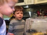 Young Brothers Excitedly Watch Popcorn Kernels Pop