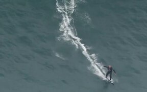 Person Rides Surfboard On High Tides - Sports - VIDEOTIME.COM