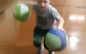 Kid Dribbles Two Balls Simultaneously