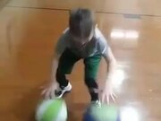 Kid Dribbles Two Balls Simultaneously