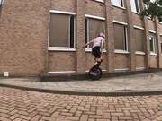 Woman Falls Off Unicycle While Trying Tricks