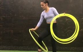 Woman Spins Multiple Hula Hoops All Over Her Body