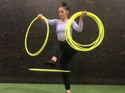 Woman Spins Multiple Hula Hoops All Over Her Body