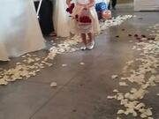 Nervous Flower Girl Throws Petals on Aisle