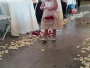 Nervous Flower Girl Throws Petals on Aisle