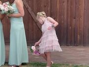 Flower Girl Tries to Shoo Away Annoying Bees