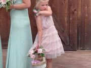 Flower Girl Tries to Shoo Away Annoying Bees