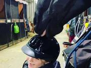 Horse Affectionately Licks Little Girl's Helmet