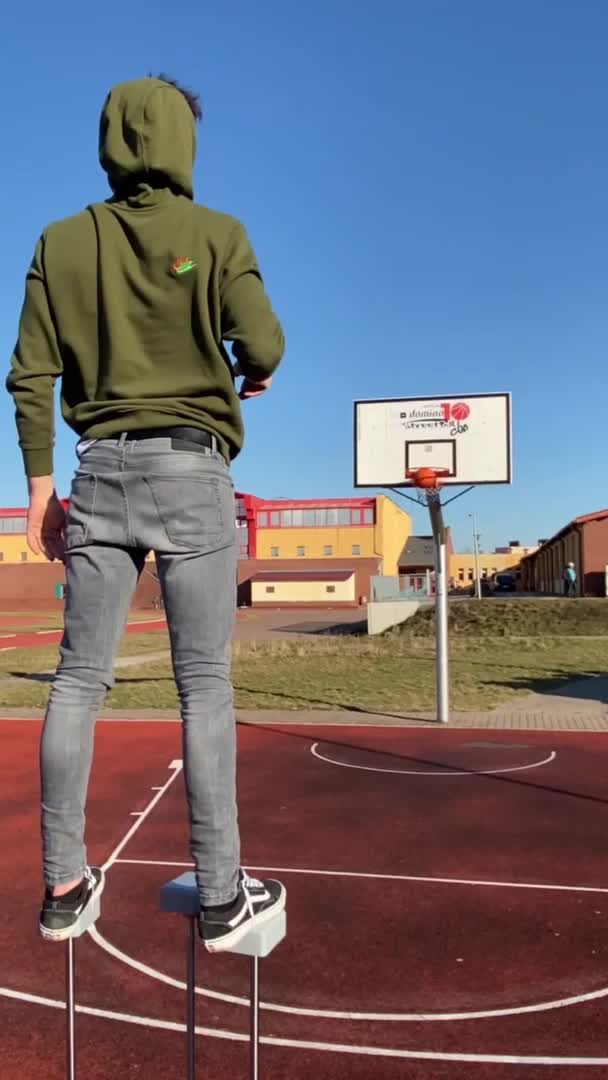 Man Shoots Hoop With Basketball