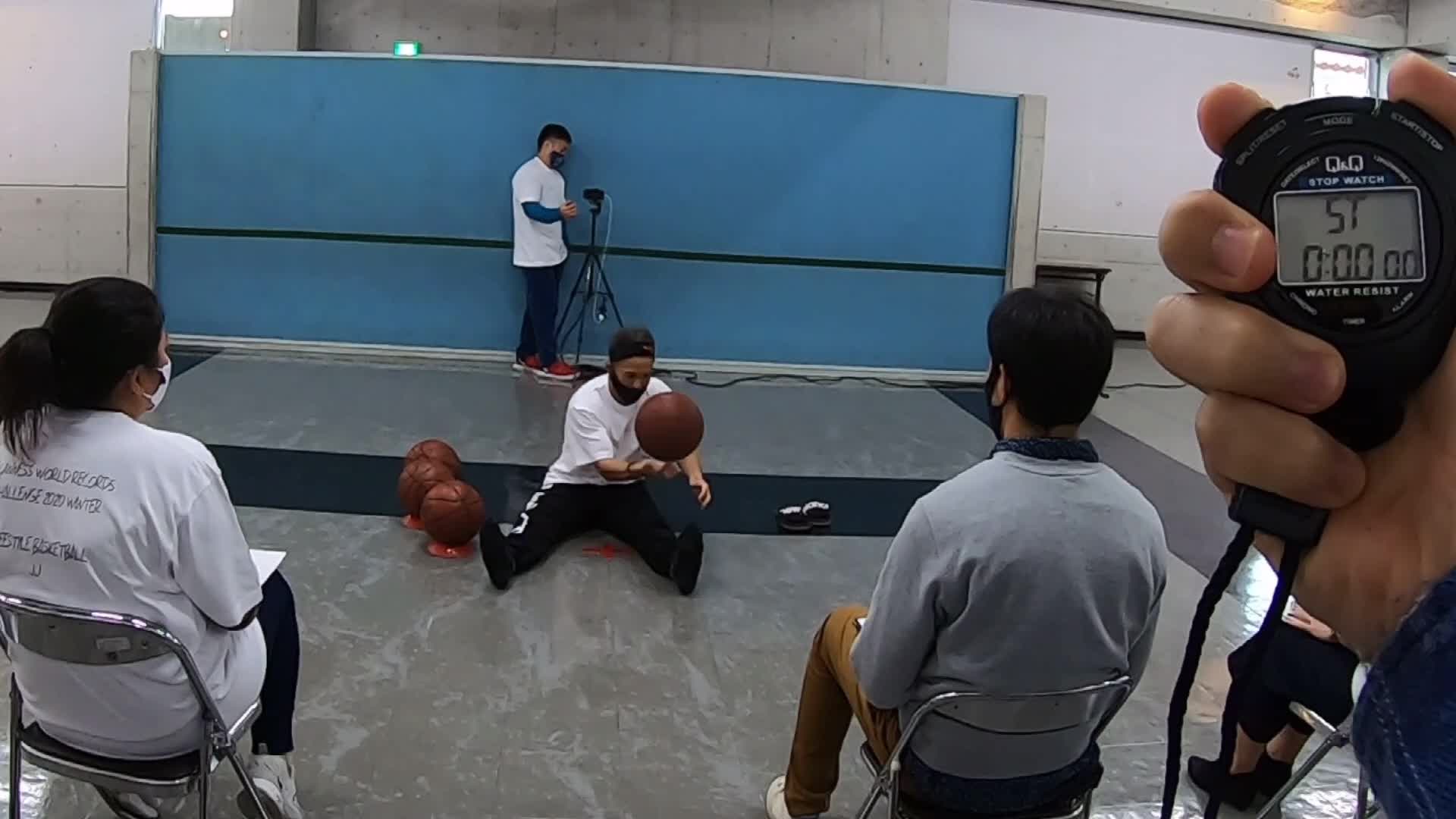 Freestyle Basketball Player Balances Four Balls Watch Now for Free