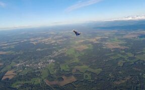 Skydiver Performs Different Poses in Sky - Fun - VIDEOTIME.COM