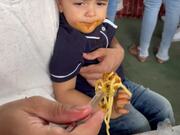 Kid Puts His Fast Hands To Work While Eating
