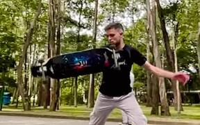 Skater Spins Longboard After Jumping Off it - Sports - VIDEOTIME.COM