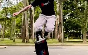 Skater Spins Longboard After Jumping Off it