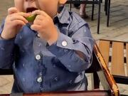 Kid Puckers Face and Giggles After Tasting Lemon
