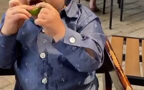 Kid Puckers Face and Giggles After Tasting Lemon - Kids - VIDEOTIME.COM