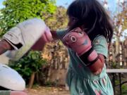 Little Girl Practices Boxing Mitt Work With Dad
