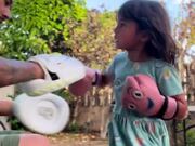 Little Girl Practices Boxing Mitt Work With Dad