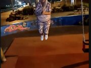 Woman Slips From Kids' Swing