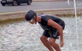 A Man Fails To Jump In Fountain