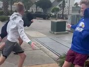 Group of Guys Try to Walk Against Strong Winds