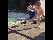 Toddler Plays With Bird and Offers It Food