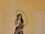Woman Performs Tricks With Hoop
