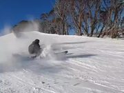 Skier Falls Into Snow After Spinning Over Ramp