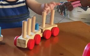 Kiddo Figures Out And Puts Together His Toy Train - Kids - VIDEOTIME.COM