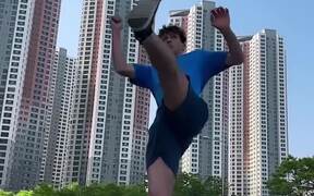 Guy Performs Spinning Taekwondo Kick on Street